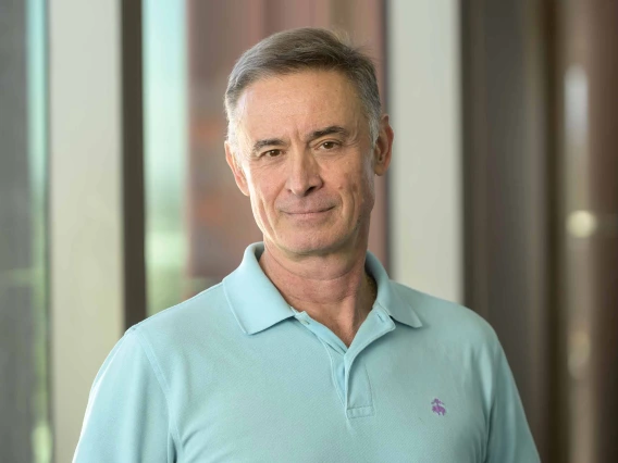 Portrait of Janko Nikolich, MD, PhD, wearing a light blue shirt and smiling slightly.